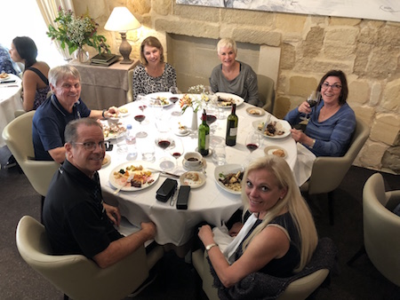 The 2018 Bordeaux Grand Cru Harvest Tour III enjoying a lovely lunch in Saint Emilion